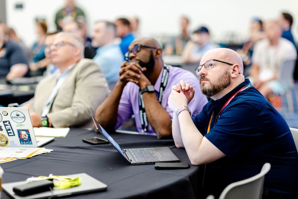 Two students listening to an InfoComm training session